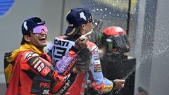 Second-placed Gresini Racing MotoGP's Spanish rider Marc Marquez (R) and winner Prima Pramac Racing's Spanish rider Jorge Martin celebrate on the podium of the French MotoGP Grand Prix race at the Bugatti circuit in Le Mans, northwestern France, on May 12, 2024. (Photo by JULIEN DE ROSA / AFP)