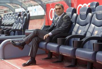 Getting comfy | Ernesto Valverde tries out his new seat at FC Barcelona's Camp Nou.