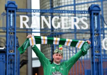 GLASGOW, SCOTLAND - DECEMBER 31: A Celtic fan poses outside Ibrox Stadium ahead of the start of the Scottish Premiership match between Rangers FC and Celtic FC at Ibrox Stadium on December 31, 2016 in Glasgow, Scotland. (Photo by Mark Runnacles/Getty Imag