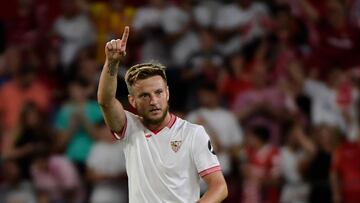 Sevilla's Croatian midfielder #10 Ivan Rakitic celebrates scoring his team's second goal that was later annulled during the Spanish Liga football match between Sevilla FC and Girona FC at the Ramon Sanchez Pizjuan stadium in Seville on August 26, 2023. (Photo by CRISTINA QUICLER / AFP)