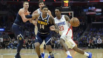 Oct 17, 2018; Los Angeles, CA, USA; LA Clippers guard Lou Williams (23) drives against Denver Nuggets guard Gary Harris (14) during the fourth quarter at Staples Center. Mandatory Credit: Jake Roth-USA TODAY Sports