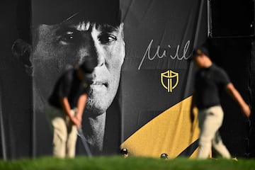 A International Team player putts in front of a banner of Captain Mike Weir during Thursday's Four-ball matches on day one of the 2024 Presidents Cup 