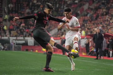 Tijuana's defender #25 Ramiro Franco and Toluca's midfielder #20 Jesus Gallardo fight for the ball during the Liga MX Clausura football league match between Tijuana and Toluca at Caliente stadium in Tijuana, Baja California, Mexico on January 10, 2025. (Photo by Guillermo Arias / AFP)