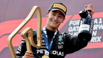 Formula One F1 - Austrian Grand Prix - Red Bull Ring, Spielberg, Austria - June 30, 2024 Mercedes' George Russell celebrates with the trophy on the podium after winning the Austrian Grand Prix REUTERS/Leonhard Foeger     TPX IMAGES OF THE DAY