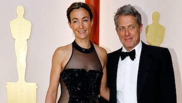 Hugh Grant and his wife Anna Elisabet Eberstein pose on the champagne-colored red carpet during the Oscars arrivals at the 95th Academy Awards in Hollywood, Los Angeles, California, U.S., March 12, 2023. REUTERS/Eric Gaillard