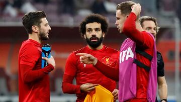 Soccer Football - Club World Cup - Semi Final - Monterrey v Liverpool - Khalifa International Stadium, Doha, Qatar - December 18, 2019 Liverpool's Adam Lallana , Mohamed Salah and Jordan Henderson during the warm up before the match REUTERS/Corin