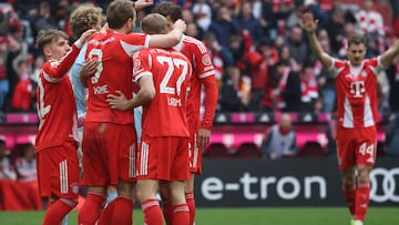 Bayern Munich's English forward #09 Harry Kane (3rd L) celebrates his 3-0 with team mates during the German first division Bundesliga football match between FC Bayern Munich and Union Berlin in Munich, southern Germany, on March 21, 2026. (Photo by Karl-Josef HILDENBRAND / AFP) / DFL REGULATIONS PROHIBIT ANY USE OF PHOTOGRAPHS AS IMAGE SEQUENCES AND/OR QUASI-VIDEO