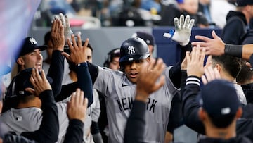 TORONTO, CANADA - APRIL 17: Juan Soto #22 of the New York Yankees celebrates in the dugout after hitting a solo home run in the eighth inning of their MLB game against the Toronto Blue Jays at Rogers Centre on April 17, 2024 in Toronto, Canada. Cole Burston/Getty Images/AFP (Photo by Cole Burston / GETTY IMAGES NORTH AMERICA / Getty Images via AFP)
