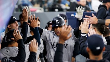 TORONTO, CANADA - APRIL 17: Juan Soto #22 of the New York Yankees celebrates in the dugout after hitting a solo home run in the eighth inning of their MLB game against the Toronto Blue Jays at Rogers Centre on April 17, 2024 in Toronto, Canada.   Cole Burston/Getty Images/AFP (Photo by Cole Burston / GETTY IMAGES NORTH AMERICA / Getty Images via AFP)