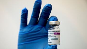 FILE PHOTO: A medical worker holds a bottle of AstraZeneca's COVID-19 vaccine at a vaccination centre in Kuala Lumpur, Malaysia May 5, 2021 in this file photo. REUTERS/Lim Huey Teng/File Photo