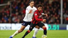 BOURNEMOUTH, ENGLAND - DECEMBER 07: Arnaut Danjuma of AFC Bournemouth is challenged by Virgil van Dijk of Liverpool during the Premier League match between AFC Bournemouth and Liverpool FC at Vitality Stadium on December 07, 2019 in Bournemouth, United Ki