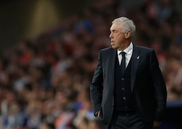 Real Madrid's Italian coach Carlo Ancelotti looks at the game during the Spanish league football match between Club Atletico de Madrid and Real Madrid CF at the Metropolitano stadium in Madrid on September 29, 2024. (Photo by OSCAR DEL POZO / AFP)