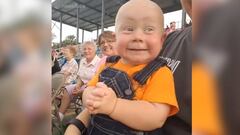 Baby watches the motor racing - check out his reactions!