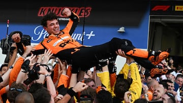 McLaren's British driver Lando Norris is tossed in the air as his team celebrates his victory in the 2024 Miami Formula One Grand Prix at Miami International Autodrome in Miami Gardens, Florida, on May 5, 2024. (Photo by Giorgio Viera / AFP)
