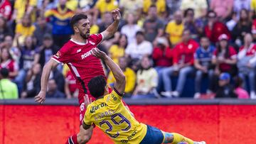 Ramon Juarez (L) of America fights for the ball with Joao Dias (R) of Toluca  during the 10th round match between America and Toluca as part of the Liga BBVA MX, Torneo Clausura 2025 at Ciudad de los Deportes Stadium, on March 01, 2025 in Mexico City, Mexico.