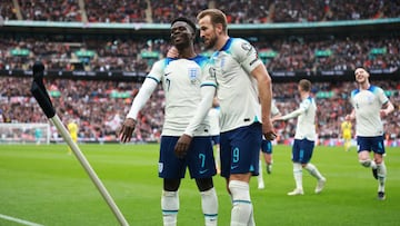 LONDON, ENGLAND - MARCH 26: Bukayo Saka of England celebrates with Harry Kane after scoring the team's second goal during the UEFA EURO 2024 qualifying round group C match between England and Ukraine at Wembley Stadium on March 26, 2023 in London, England. (Photo by Eddie Keogh - The FA/The FA via Getty Images)