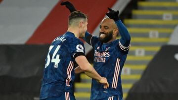 Arsenal&#039;s French striker Alexandre Lacazette (R) celebrates with Arsenal&#039;s Swiss midfielder Granit Xhaka (L) after scoring their third goal during the English Premier League football match between Sheffield United and Arsenal at Bramall Lane in 