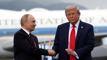 Russian President Vladimir Putin and U.S. President Donald Trump pose on a podium on the tarmac after they arrived to attend a meeting at Joint Base Elmendorf-Richardson in Anchorage, Alaska, U.S., August 15, 2025. Sputnik/Gavriil Grigorov/Pool via REUTERS ATTENTION EDITORS - THIS IMAGE WAS PROVIDED BY A THIRD PARTY.