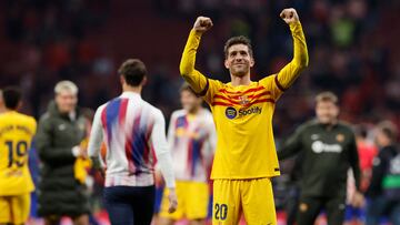 Barcelona's Spanish midfielder #20 Sergi Roberto celebrates his team's victory after the Spanish league football match between Club Atletico de Madrid and FC Barcelona at the Metropolitano stadium in Madrid on March 17, 2024. (Photo by OSCAR DEL POZO / AFP)