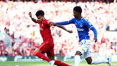 LIVERPOOL, ENGLAND - APRIL 24: Luis Diaz of Liverpool battles for the ball with Demarai Gray of Everton during the Premier League match between Liverpool and Everton at Anfield on April 24, 2022 in Liverpool, England. (Photo by Clive Brunskill/Getty Images)