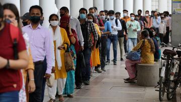 People wearing protective face masks stand in a line to enter a metro station amidst the spread of the coronavirus disease (COVID-19), in New Delhi, India, September 14, 2020. REUTERS/Anushree Fadnavis