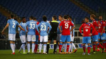 Referee Massimiliano Irrati halts the match on hearing racist chants