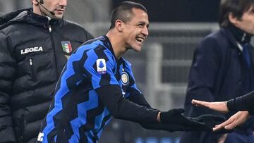 Inter Milan&#039;s Chilean forward Alexis Sanchez (L) and Inter Milan&#039;s Argentine forward Lautaro Martinez tap hands as they substitute during the Italian Serie A football match Inter vs Juventus on January 17, 2021 at the San Siro stadium in Milan. (Photo by MIGUEL MEDINA / AFP)