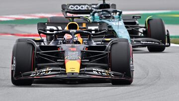 Red Bull's Dutch driver Max Verstappen and Aston Martin's Canadian driver Lance Stroll (back) compete during the qualifying session for the Spanish Formula One Grand Prix at the Circuit de Catalunya on June 3, 2023 in Montmelo, on the outskirts of Barcelona. (Photo by JAVIER SORIANO / AFP)