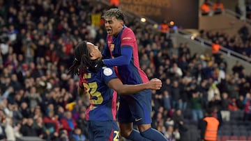 Barcelona's French defender #23 Jules Kounde celebrates with Barcelona's Spanish forward #19 Lamine Yamal (R) scoring his team's second goal during the Spanish Copa del Rey (King's Cup) last 16 first leg football match between FC Barcelona and Real Betis at the Estadi Olimpic Lluis Companys in Barcelona on January 15, 2025. (Photo by MANAURE QUINTERO / AFP)
