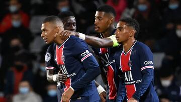 Paris Saint-Germain&#039;s French forward Kylian Mbappe (1st-L) celebrates after scoring a goal with Paris Saint-Germain&#039;s French defender Colin Dagba (1st-R) and Paris Saint-Germain&#039;s French defender Presnel Kimpembe during the French L1 footba