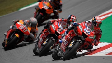 (R to L) Mission Winnow Ducati's Italian rider Andrea Dovizioso, Mission Winnow Ducati's Italian rider Danilo Petrucci, Red Bull KTM Factory Racing's French rider Johann Zarco and Repsol Honda Team's Spanish rider Marc Marquez ride during the Catalunya MotoGP Grand Prix second free practice session at the Catalunya racetrack in Montmelo, near Barcelona, on June 14, 2019. (Photo by LLUIS GENE / AFP)