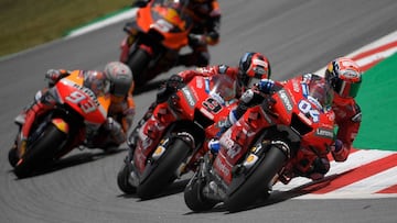 (R to L) Mission Winnow Ducati&#039;s Italian rider Andrea Dovizioso, Mission Winnow Ducati&#039;s Italian rider Danilo Petrucci, Red Bull KTM Factory Racing&#039;s French rider Johann Zarco and Repsol Honda Team&#039;s Spanish rider Marc Marquez ride during the Catalunya MotoGP Grand Prix second free practice session at the Catalunya racetrack in Montmelo, near Barcelona, on June 14, 2019. (Photo by LLUIS GENE / AFP)