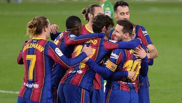 Barcelona&#039;s players celebrate their second goal during the Spanish league football match between Real Betis and FC Barcelona at the Benito Villamarin stadium in Seville on February 7, 2021. (Photo by CRISTINA QUICLER / AFP)