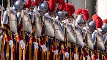 VATICAN CITY, VATICAN - DECEMBER 25: Vatican Swiss Guards patrol St. Peter's Square during the Christmas Urbi Et Orbi Blessing and the traditional Christmas Day message delivered by Pope Francis from the central loggia of St. Peter's Basilica at The Vatican on December 25, 2022 in Vatican City, Vatican. Looking at our world today, the Pope called on everyone to "see the faces of our Ukrainian brothers and sisters" who are experiencing darkness and cold this year, many faraway from home due to ten months of war devastation and decried today's grave "famine of peace" in other parts of the world of what he termed this "third world war." (Photo by Alessandra Benedetti - Corbis/Corbis via Getty Images)