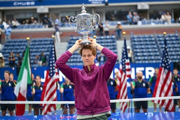 Italy's Jannik Sinner holds the trophy after winning his men's final match against USA's Taylor Fritz on day fourteen of the US Open