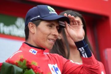 Movistar's Colombian cyclist Nairo Quintana celebrates on the podium after winning the red jersey during the 15th stage of the 71st edition of "La Vuelta" Tour of Spain, a 120km route Sabinanigo to Formigal, on September 4, 2016.