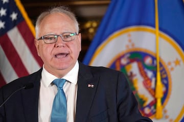 Tim Walz speaks to the media in late 2022.