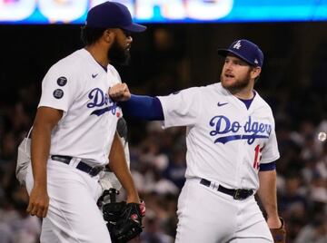 Jun 29, 2021; Los Angeles, California, USA; Los Angeles Dodgers first baseman Max Muncy (13) hits the chest of relief pitcher Kenley Jansen (74) at the conclusion of the Dodgers 3-1 win over the San Francisco Giants at Dodger Stadium. Mandatory Credit: Ro