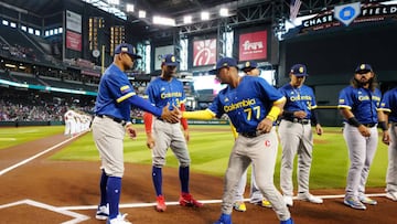 PHOENIX, AZ - MARCH 11: Dayan Frias #77 of Team Colombia is greeted by Manager Jolbert Cabrera #8 during player introductions prior to Game 1 of Pool C between Team Colombia and Team Mexico at Chase Field on Saturday, March 11, 2023 in Phoenix, Arizona. (Photo by Daniel Shirey/WBCI/MLB Photos via Getty Images)