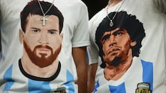 Soccer Football - FIFA World Cup Qatar 2022 - Semi Final - Argentina v Croatia - Lusail Stadium, Lusail, Qatar - December 13, 2022 Argentina fans wear Lionel Messi and former player Diego Maradona shirts inside the stadium before the match REUTERS/Molly Darlington