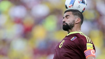 Venezuela&#039;s captain Tomas Rincon heads the ball during a 2018 Russia World Cup qualifying soccer match against Colombia in San Cristobal, Venezuela, Thursday, Aug. 31, 2017. (AP Photo/Fernando Llano)