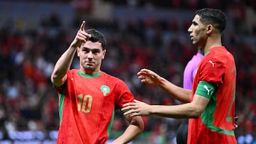 Morocco's forward #10 Brahim Diaz celebrates scoring his team's first goal with Morocco's defender #02 Achraf Hakimi during the Africa Cup of Nations (CAN) round of 16 football match between Morocco and Tanzania at Prince Moulay Abdallah Stadium in Rabat on January 4, 2026. (Photo by SEBASTIEN BOZON / AFP)