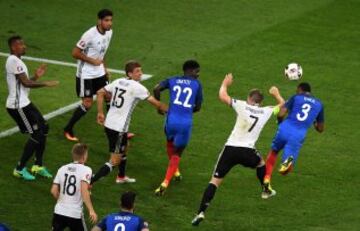 Schweinsteiger and Evra jump for the ball as the Germany man is penalised for handball and France are awarded a spot-kick.