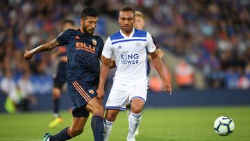 LEICESTER, ENGLAND - AUGUST 01: Layton Ndukwu of Leicester is tackled by Ezequiel Garay of Valencia during the pre-season friendly match between Leicester City and Valencia at The King Power Stadium on August 1, 2018 in Leicester, England. (Photo by Mich