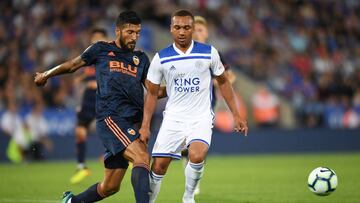 LEICESTER, ENGLAND - AUGUST 01: Layton Ndukwu of Leicester is tackled by Ezequiel Garay of Valencia during the pre-season friendly match between Leicester City and Valencia at The King Power Stadium on August 1, 2018 in Leicester, England.  (Photo by Mich