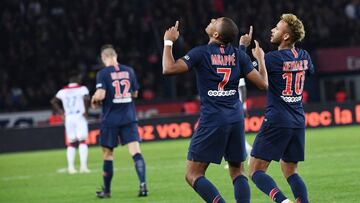 Paris Saint-Germain's French forward Kylian Mbappe (L) celebrates wiht Paris Saint-Germain's Brazilian forward Neymar after he scored a goal during the French L1 football match between Paris Saint-Germain (PSG) and Olympique de Lyon (OL) on Octo
