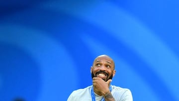 Soccer Football - World Cup - Third Place Play Off - Belgium v England - Saint Petersburg Stadium, Saint Petersburg, Russia - July 14, 2018  Belgium assistant coach Thierry Henry reacts after receiving the bronze World Cup medal  