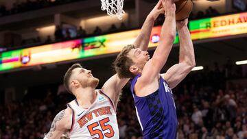 New York Knicks center Isaiah Hartenstein (55) blocks the shot attempt by Sacramento Kings forward Domantas Sabonis (10) during the fourth quarter at Golden 1 Center.