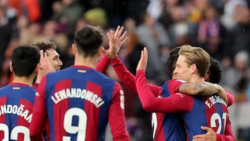 Barcelona's Dutch midfielder #21 Frenkie de Jong (R) celebrates with teammates scoring his team's third goal with teammates during the Spanish league football match between FC Barcelona and Getafe CF at the Estadi Olimpic Lluis Companys in Barcelona on February 24, 2024. (Photo by LLUIS GENE / AFP)