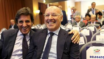 Juventus Sporting Director Giuseppe Marotta (R) and Torino president Urbano Cairo smile as they arrive at an election for the Italian Football Federation (FIGC) presidency in Rome August 11, 2014. FIGC vice-president Carlo Tavecchio faces former AC Milan 